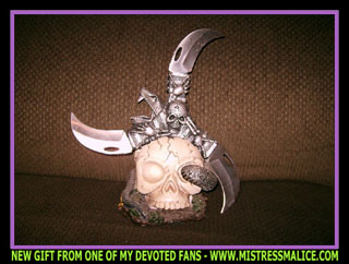 SKULL SWORD AND MATCHING STAND